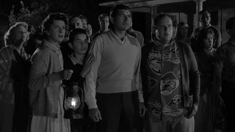 Claude Akins' Steve Brand stands in a group of residents from Maple Street in The Twilight Zone