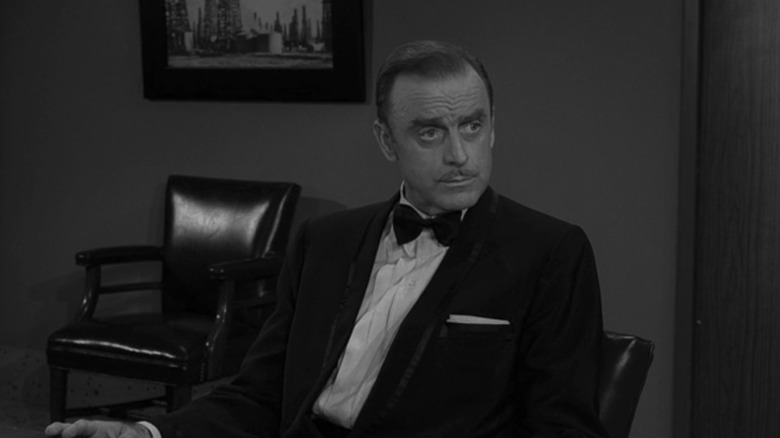 John Dehner's Alan Richards sits in a meeting room wearing a tuxedo in The Twilight Zone