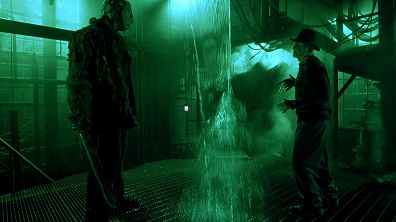 Jason and Freddy talk at opposite ends of a warehouse stunt in Freddy Vs. Jason