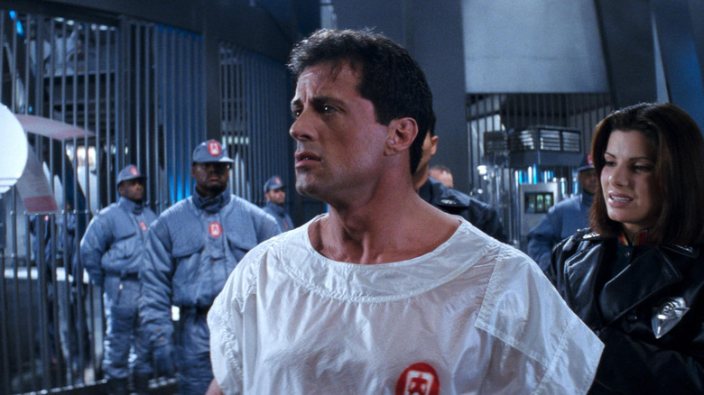 Sylvester Stallone as John Spartan looking confused in Demolition Man