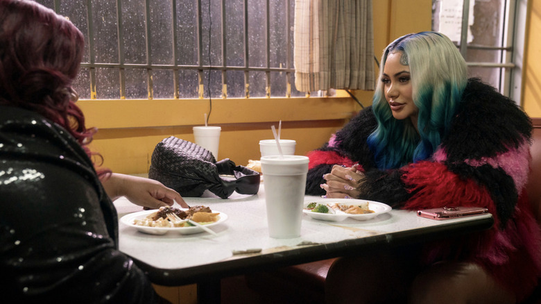 Body sits at a diner table across from somebody