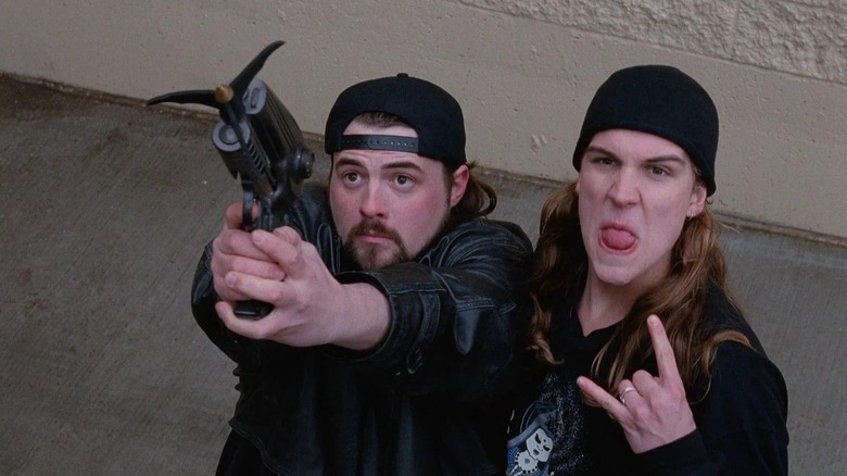 Jay and Silent Bob getting ready to use the grappling hook in Mallrats