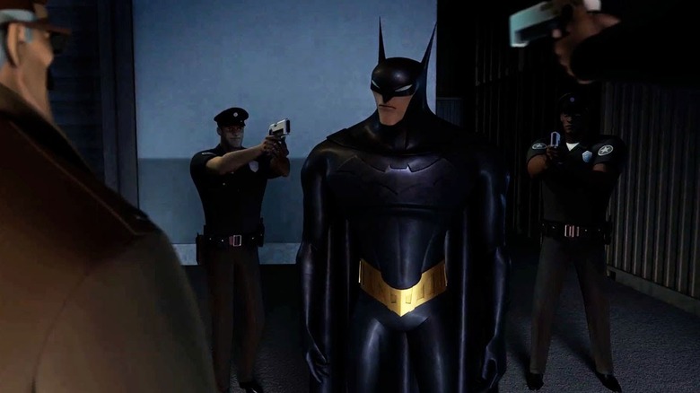 Batman is surrounded by cops pointing guns at him in Beware the Batman
