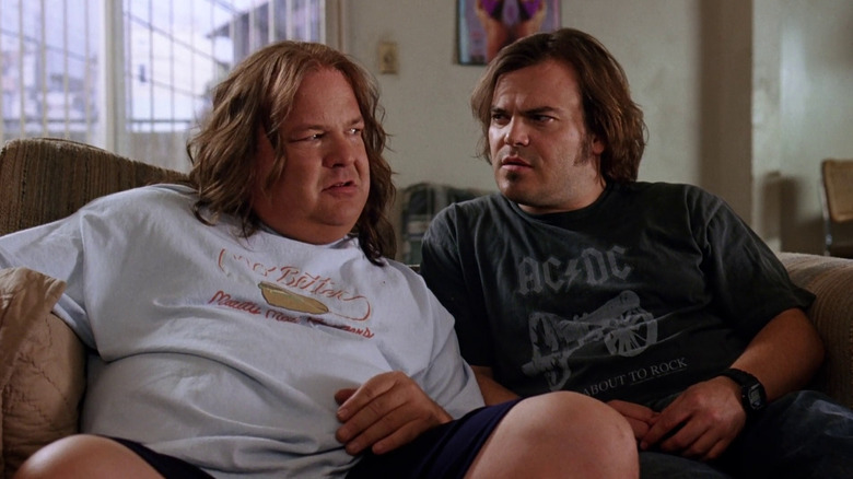 KG and JB sitting on a couch in Tenacious D and the Pick of Destiny.