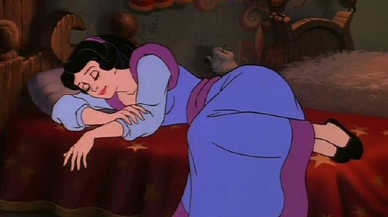 Snow White sleeping in a bed in Happily Ever After.