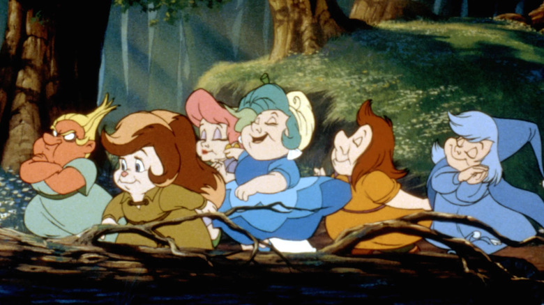The Dwarfelles happily prancing to help Snow White in Happily Ever After.