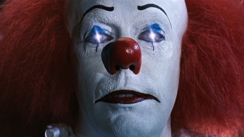 Tim Curry as Pennywise in IT