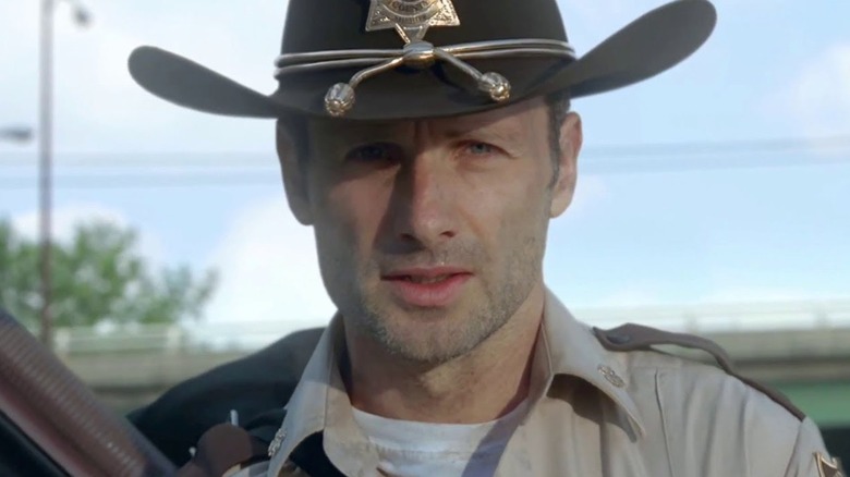 Rick Grimes in his sheriff outfit on The Walking Dead, looking straight into the camera lens