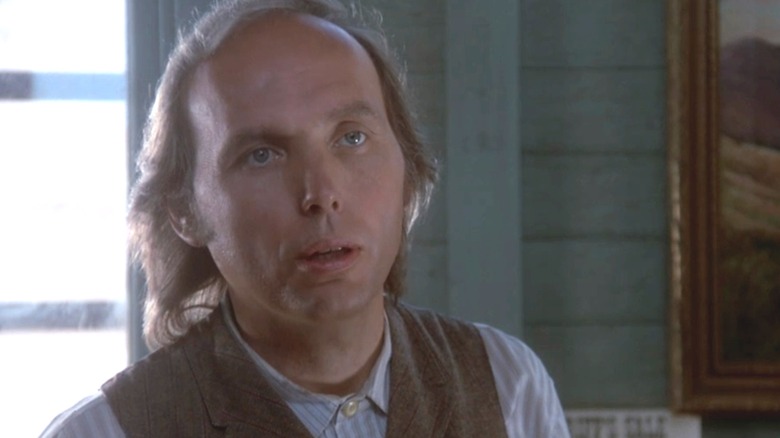 Dwight Yoakam's Valentine Casey looks across frame in South of Heaven, West of Hell