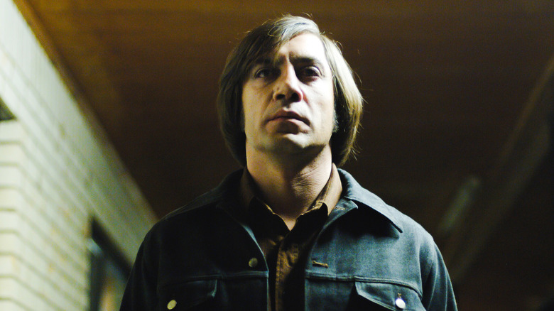 Javier Bardem looking menacing as hitman Anton Chigurh in No Country for Old Men
