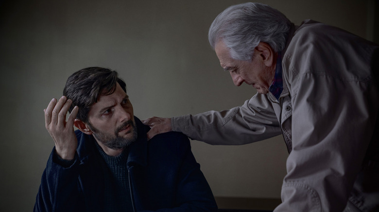 An upset Tom is comforted by Pete in The Whisper Man