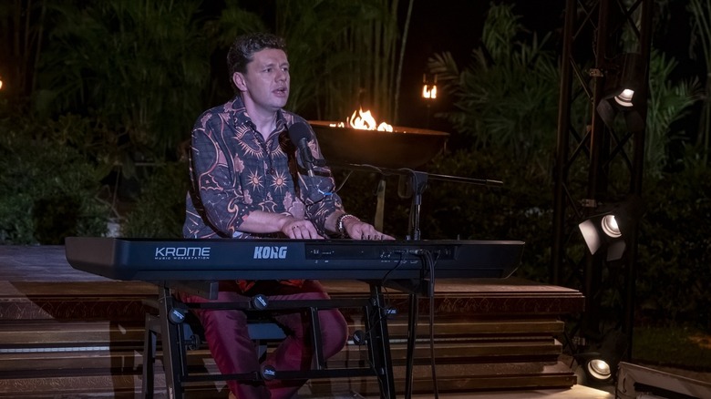Fabian playing the keyboard and singing on The White Lotus