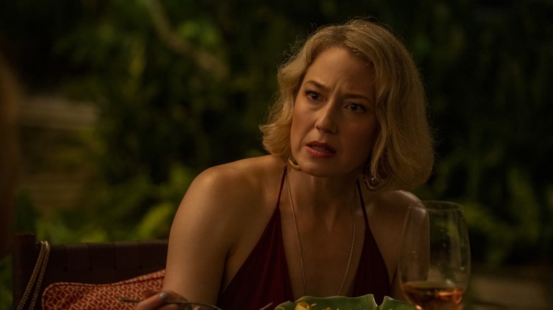 Laurie looking aggrieved at dinner on The White Lotus
