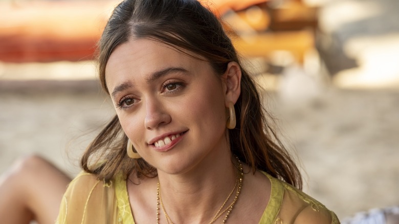 Chelsea smiling on the beach on The White Lotus