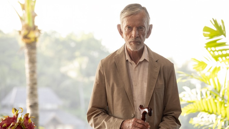 Jim with his cane looking ominous on The White Lotus