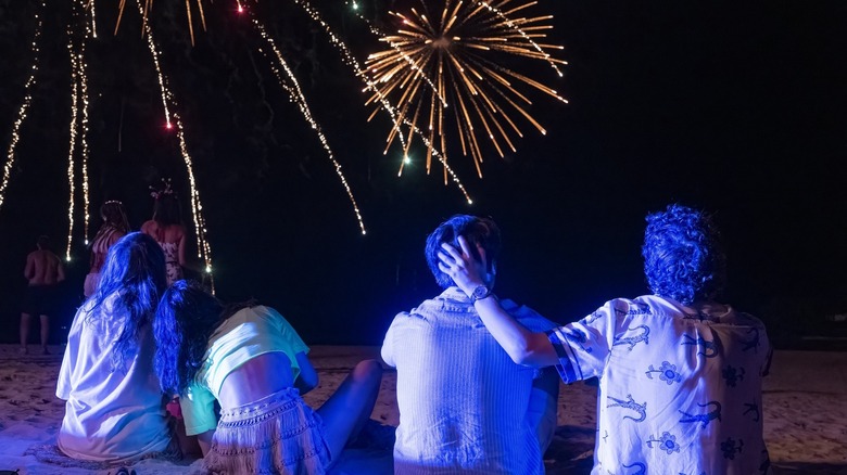 Chelsea Chloe Saxon and Lochlan on the beach watching fireworks on The White Lotus