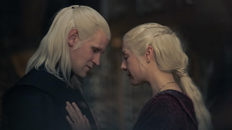 Rhaenyra with her hand on Daemon's chest on House of the Dragon