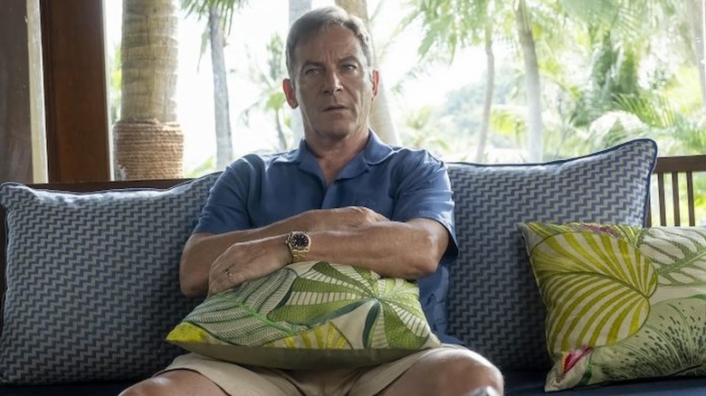 Jason Isaacs holding a pillow in The White Lotus season 3