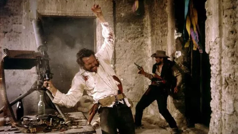 Lyle Gorch (Warren Oates) is shot amid a firefight in The Wild Bunch (1969)