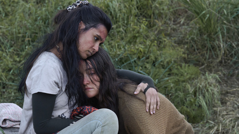 Sophia Ali as Fatin and Sarah Pidgeon as Leah in The Wilds