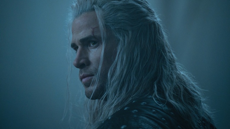 Liam Hemsworth's Geralt looks at someone offscreen in Season 4 of The Witcher