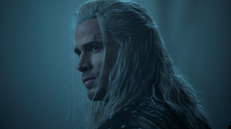 Liam Hemsworth as Geralt of Rivia looking over his shoulder in The Witcher season 4
