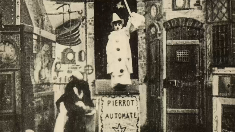 Gugusse with a boy-sized automaton in Gugusse and the Automaton