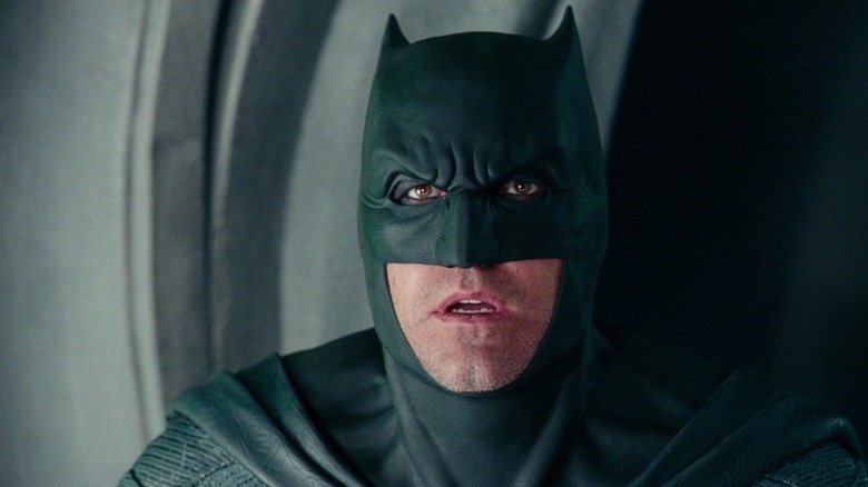 Ben Affleck as Batman looking in shock as The Flash runs in Justice League