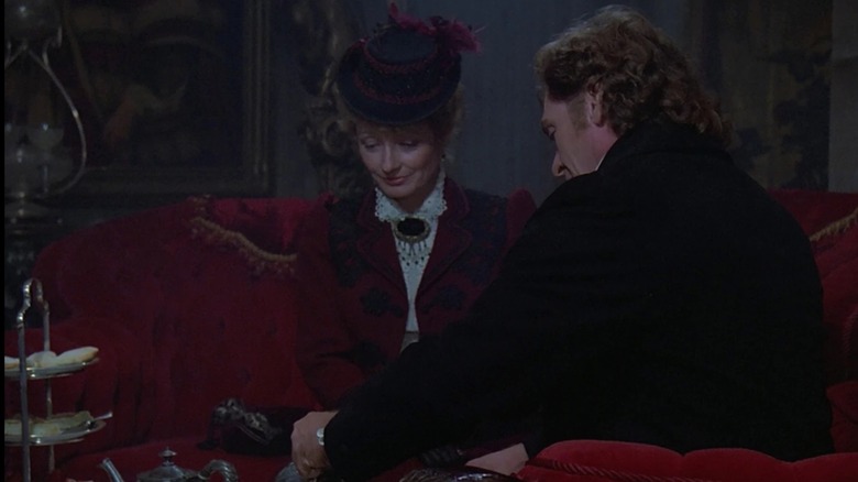 Dr Pulaski (Diana Muldar) and Professor Moriarty (Daniel Davis) having a nice drink on Star Trek The Next Enterprise