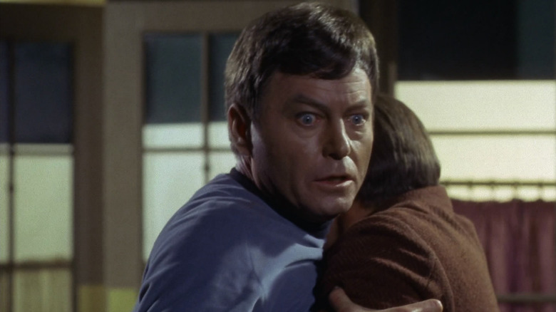 DeForest Kelley as McCoy looking shocked on Star Trek