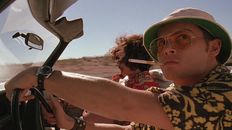 Raoul Duke and Dr. Gonzo in a convertable in bat country in Fear and Loathing in Las Vegas.