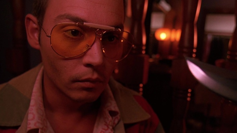 Raoul Duke with a knife pointed at him in Fear and Loathing in Las Vegas.