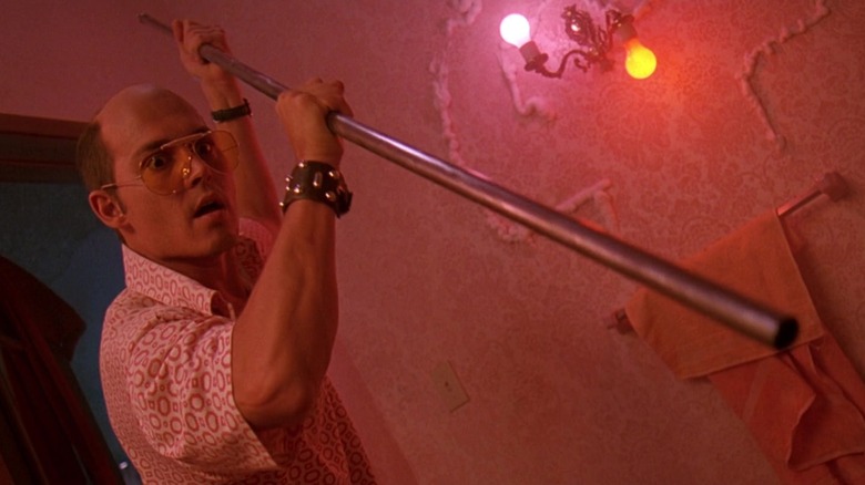 Raoul Duk holding a curtain rod like a harpoon in Fear and Loathing in Las Vegas.
