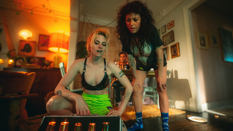 Frankie and Molly look at a suitcase full of mysterious drugs in The Wrong Girls