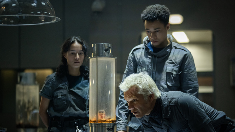 Kirsh, Curly, and Isaac studying an alien in the Neverland lab in Alien: Earth