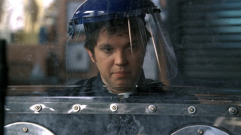 Eric Millegan's Zack Addy looks to his right while wearing protective headgear in Bones