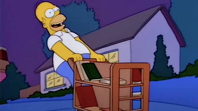 Simpsons Homer riding library cart
