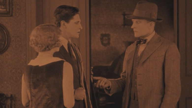 Ivor Novello, June Tripp, and Malcolm Keen in The Lodger