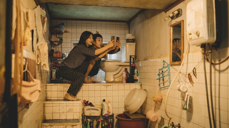 The Kim siblings in Parasite try to get service in the bathroom