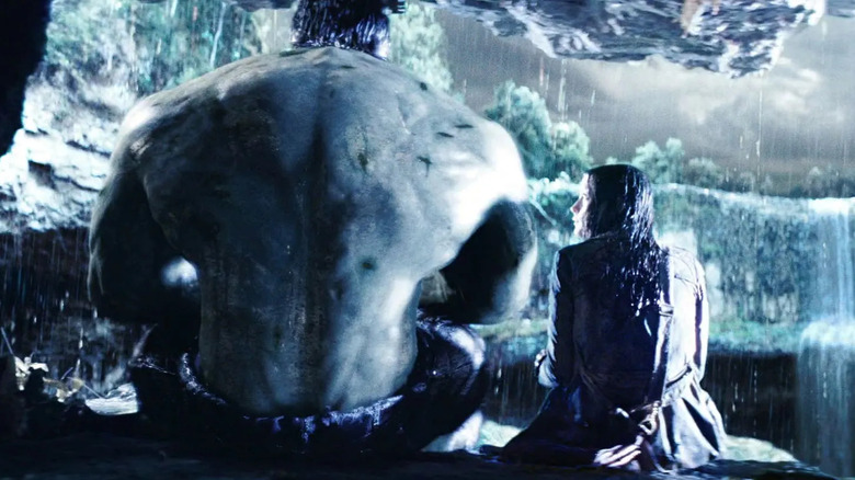 Edward Norton as the Hulk sitting next to Liv Tyler as Betty as it storms in The Incredible Hulk