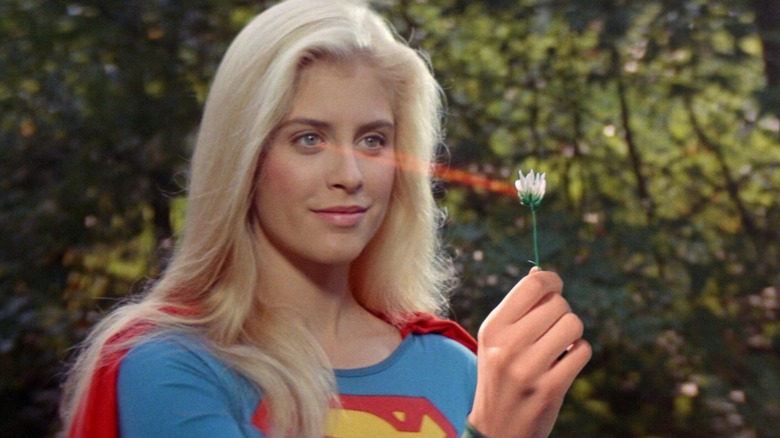 Supergirl using her eye beams on a flower in Supergirl.