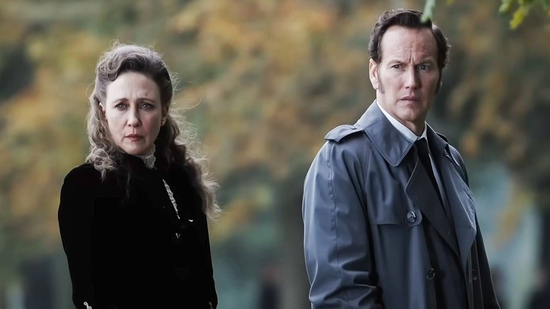 Lorraine and Ed Warren looking concerned in the autumn in The Conjuring: Last Rites
