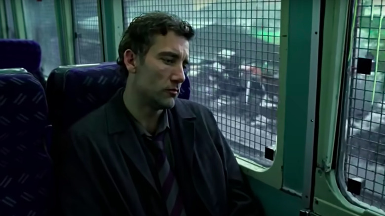 Clive Owen rides train in "Children of Men"
