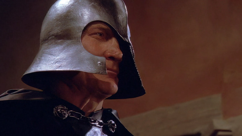 Voltan wearing a helmet in Hawk the Slayer