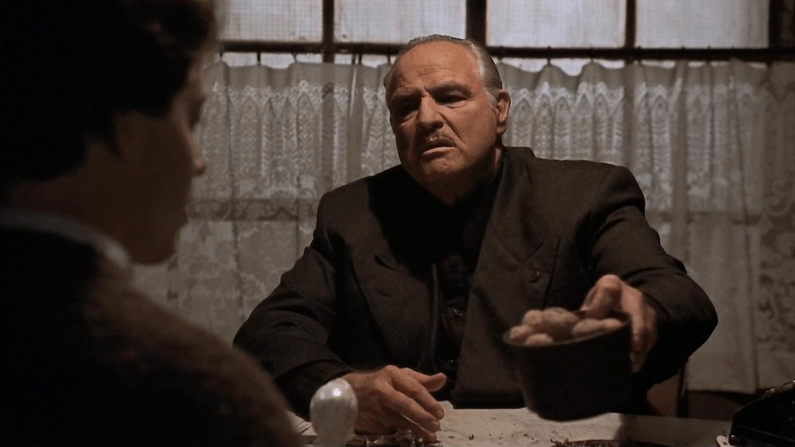 This 1990 Marlon Brando Crime Comedy Got A Near-Perfect Score From Roger Ebert image