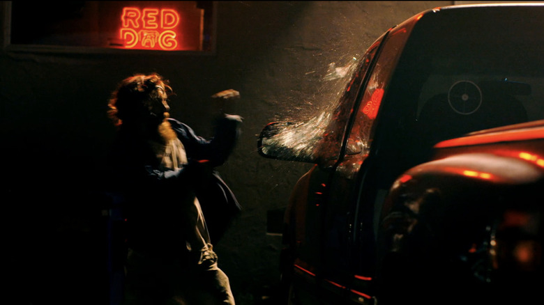 Macon Blair's Dwight Evans smashes a car window in Blue Ruin