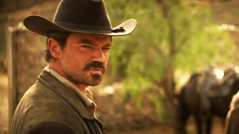 Dominic Cooper's Arthur McCoy turns to look behind him in That Dirty Black Bag