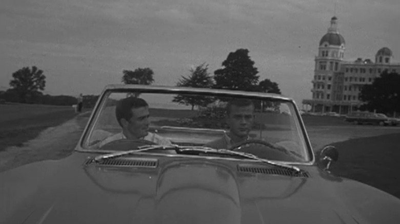 Glenn Corbett's Lincoln Case sits beside Martin Milner's Tod Stiles as they drive in a car in Route 66