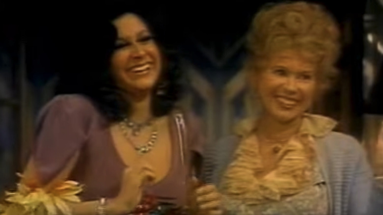 Jeannie Linero's Suzy Marta Rocket stands smiling beside Gloria LeRoy's Millie in Hot l Baltimore