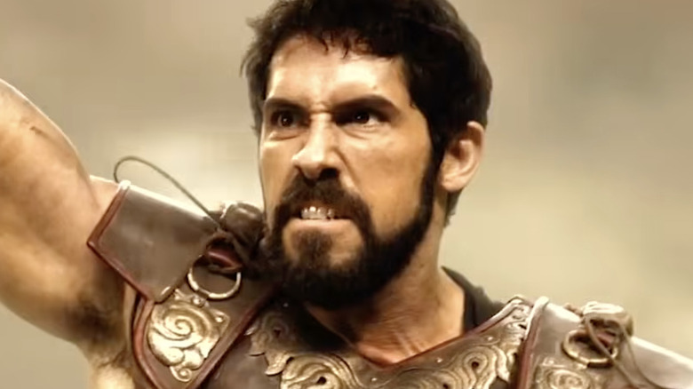 Amphitryon rasiing his fist in triumph in The Legend of Hercules